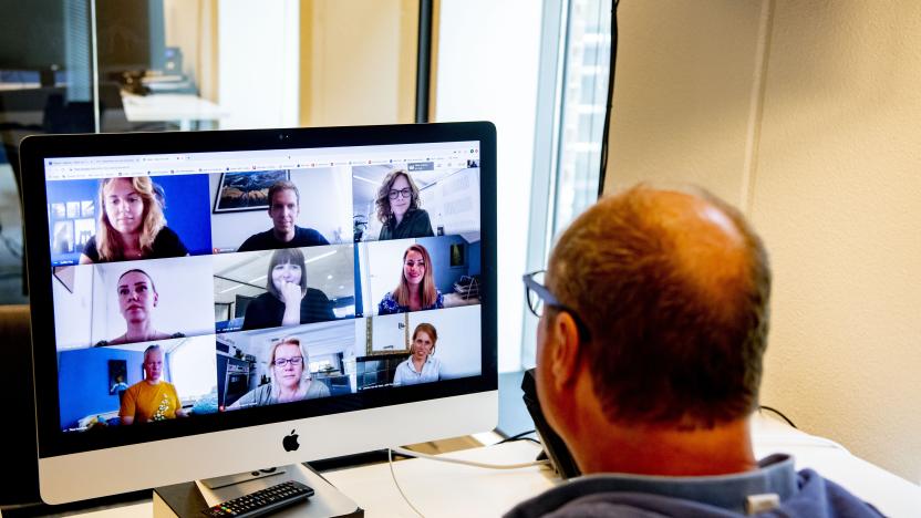 THE HAGUE, NETHERLANDS - 2020/06/12: A director is seen having an online meeting with his employees through a laptop on zoom video call app.
The Dutch government has ordered all offices to be closed until further notice in attempt to control the spread of the COVID-19 Coronavirus. (Photo by Robin Utrecht/SOPA Images/LightRocket via Getty Images)