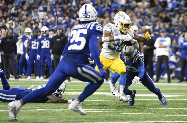 INDIANAPOLIS, IN - DECEMBER 26: Los Angeles Chargers running back Austin Ekeler (30) advances the ball during the NFL football game between the Los Angeles Chargers and the Indianapolis Colts on December 26, 2022, at Lucas Oil Stadium in Indianapolis, Indiana. (Photo by Michael Allio/Icon Sportswire via Getty Images)