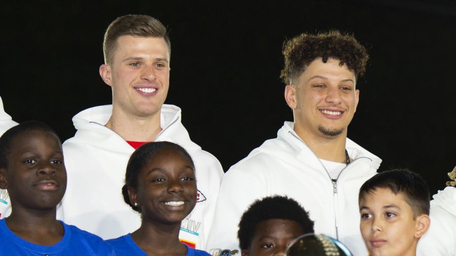 Getty Images - MIAMI, FL - JANUARY 27: Back row from left, San Francisco 49ers Defensive Tackle DeForest Buckner (99), Kansas City Chiefs Place Kicker Harrison Butker (7), Kansas City Chiefs Quarterback Patrick Mahomes (15), Kansas City Chiefs Safety Tyrann Mathieu (32), Kansas City Chiefs Punter Dustin Colquitt (2) and Kansas City Chiefs Linebacker Anthony Hitchens (53) pose with children and the Vince Lombardi Trophy during the NFL Super Bowl Opening Night at Marlins Park in Miami, Fla. on January 27, 2020 (Photo by Doug Murray/Icon Sportswire via Getty Images)