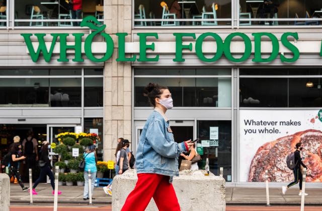 NEW YORK, NEW YORK - SEPTEMBER 29: A person wears a face mask outside Whole Foods Market in Union Square as the city continues Phase 4 of re-opening following restrictions imposed to slow the spread of coronavirus on September 29, 2020 in New York City. The fourth phase allows outdoor arts and entertainment, sporting events without fans and media production. (Photo by Noam Galai/Getty Images)