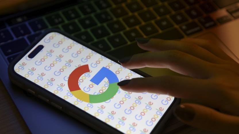 ANKARA, TURKIYE - DECEMBER 07: A mobile phone screen displays the Google logo with a laptop in the background in Ankara, Turkiye on December 07, 2023. (Photo by Dilara Irem Sancar/Anadolu via Getty Images)