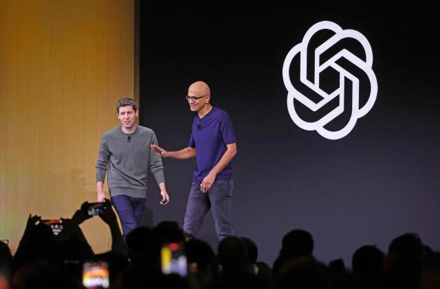 SAN FRANCISCO, CALIFORNIA - NOVEMBER 06: Microsoft CEO Satya Nadella (R) greets OpenAI CEO Sam Altman during the OpenAI DevDay event on November 06, 2023 in San Francisco, California. Altman delivered the keynote address at the first-ever Open AI DevDay conference. 