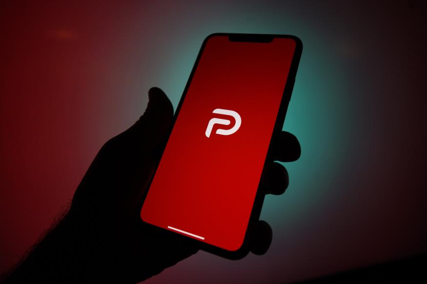 The Parler logo is seen on an Apple iPhone in this photo illustration in Warsaw, Poland on January 10, 2021. The Parler app, developed as an alternative social media platform for conservatives has been taken from the Apple App Store and the Google Play store. Supporters of Donald Trump including many who stormed the Capitol on Wednesday communicate via the app. The app has been removed from stores for containing a large number of posts that encourge and incite violence. Aamazon Web Services (AWS) has also announced it is no longer hosting the platform on it's cloud services. (Photo by Jaap Arriens/NurPhoto via Getty Images)