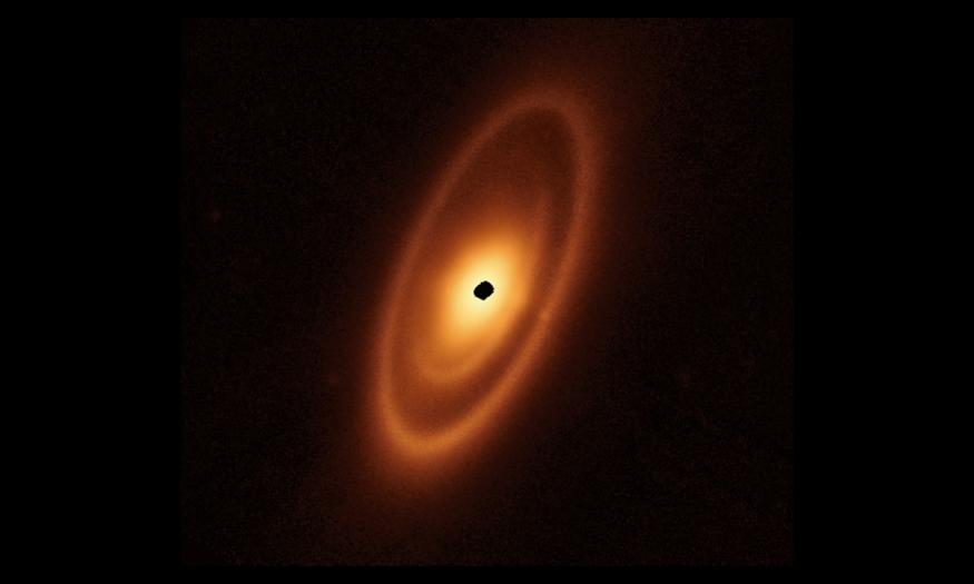 This image of the dusty debris disk surrounding the young star Fomalhaut is from Webb’s Mid-Infrared Instrument (MIRI). It reveals three nested belts extending out to 14 billion miles (23 billion kilometers) from the star. The inner belts – which had never been seen before – were revealed by Webb for the first time.