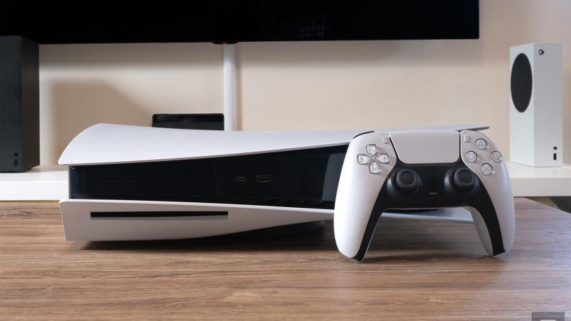 Sony PlayStation 5 with Xbox consoles in background