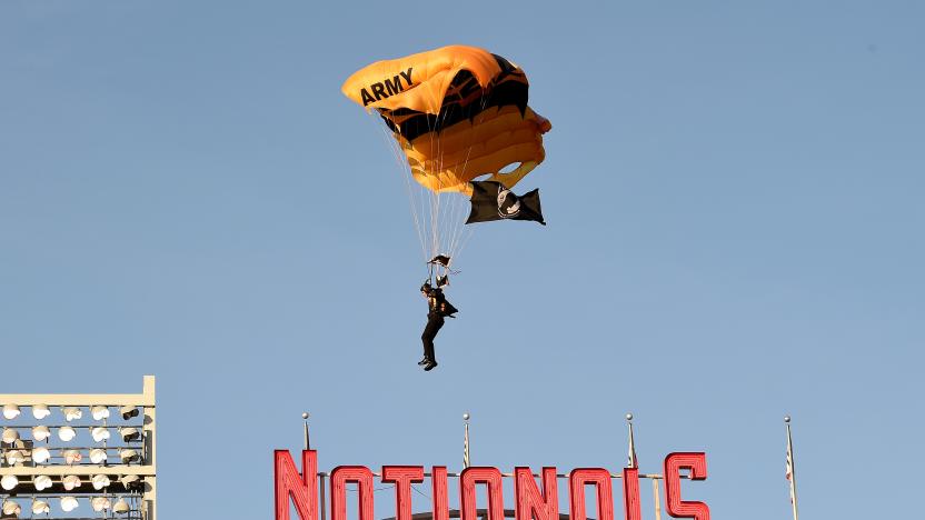 WASHINGTON, DC - APRIL 20: A member of the US Army Parachute Team The Golden Knights lands at Nationals Park before the game between the Washington Nationals and the Arizona Diamondbacks on April 20, 2022 in Washington, DC. (Photo by Greg Fiume/Getty Images)