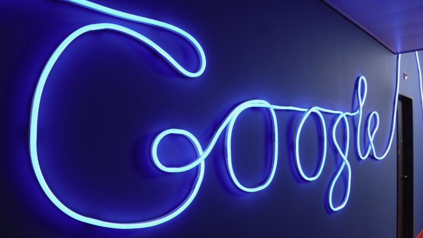 A hallway decorated with an illuminated Google logo.                                    