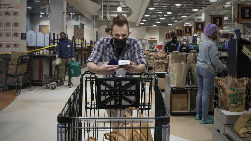 WASHINGTON,DC-APR6: Matt Gillette, a 36 year-old Instacart shopper, checks his order at a Harris Teeter in Washington, DC, April 6, 2020. For the past two years he's been part of the gig economy, driving for Lyft, doing handiwork on TaskRabbit. The work was so unstable he's been on the verge of homelessness, crashing with some friends and asking others to take in his beloved dog, a lab mix named Nitro.

For years there has been talk of a divided America, of an economy that's highly beneficial to some and detrimental to others. The wrath of a highly contagious, sometimes lethal virus has shown us where, precisely, it stands: at the front door. On one side are people who have the luxury of staying safely at home, working -- or not -- and ordering whatever they want to be delivered. On the other side are those doing the delivering. (Photo by Evelyn Hockstein/For The Washington Post via Getty Images)