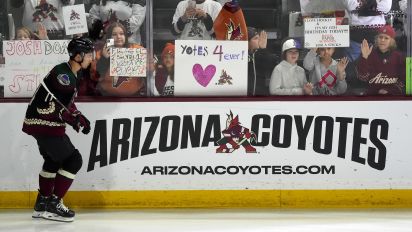 Associated Press - Arizona Coyotes' Dylan Guenther skates past fans as players warm up for an NHL hockey game against the Edmonton Oilers on Wednesday, April 17, 2024, in Tempe, Ariz. The Coyotes are moving to Salt Lake City in a deal that could be signed less than 24 hours after the game. Hockey could return, perhaps within five years, but the stark reality is this is the end for the foreseeable future. (AP Photo/Ross D. Franklin)