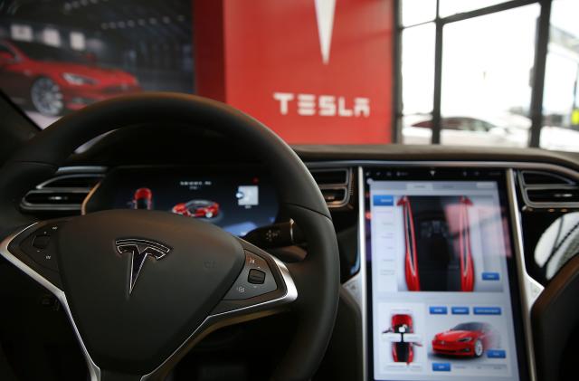 NEW YORK, NY - JULY 05:  The inside of a Tesla vehicle is viewed as it sits parked in a new Tesla showroom and service center in Red Hook, Brooklyn on July 5, 2016 in New York City. The electric car company and its CEO and founder Elon Musk have come under increasing scrutiny following a crash of one of its electric cars while using the controversial autopilot service. Joshua Brown crashed and died in Florida on May 7 in a Tesla car that was operating on autopilot, which means that Brown's hands were not on the steering wheel.  (Photo by Spencer Platt/Getty Images)