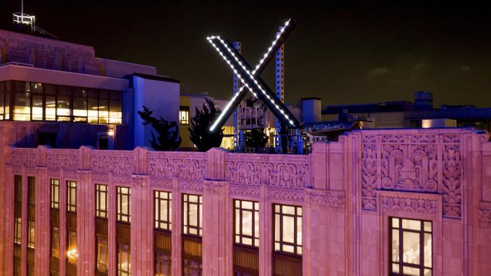 Workers install lighting on an "X" sign atop the company headquarters, formerly known as Twitter, in downtown San Francisco, on Friday, July 28, 2023. San Francisco has launched an investigation into the sign as city officials say replacing letters or symbols on buildings, or erecting a sign on top of one, requires a permit. (AP Photo/Noah Berger)