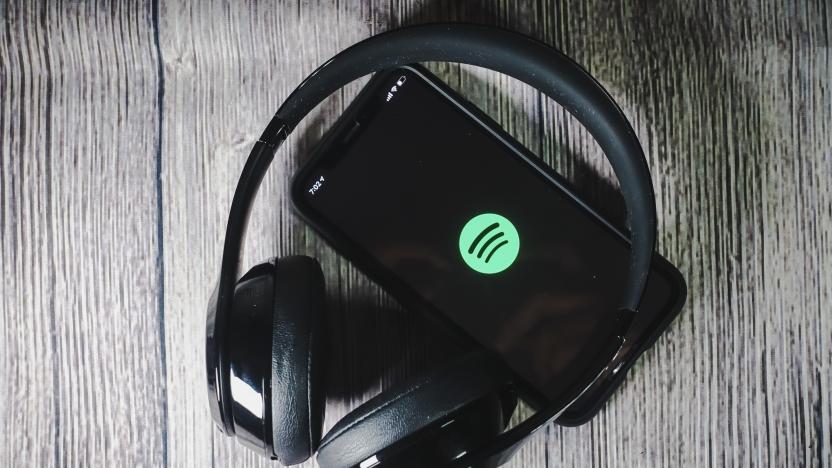 An iphone 11 screen showing spotify icon with beats earphone, perfect for listening musics on the go