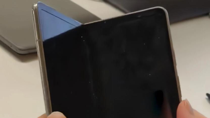 A screenshot from a recently leaked video of the Pixel Fold. The device features a book-like design with an internal display that has chunky bezels and a noticeable display crease.