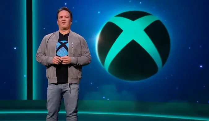 Microsoft Gaming CEO Phil Spencer and the Xbox logo