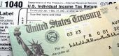 Tax return check on 1040 form background. (Getty Images) 