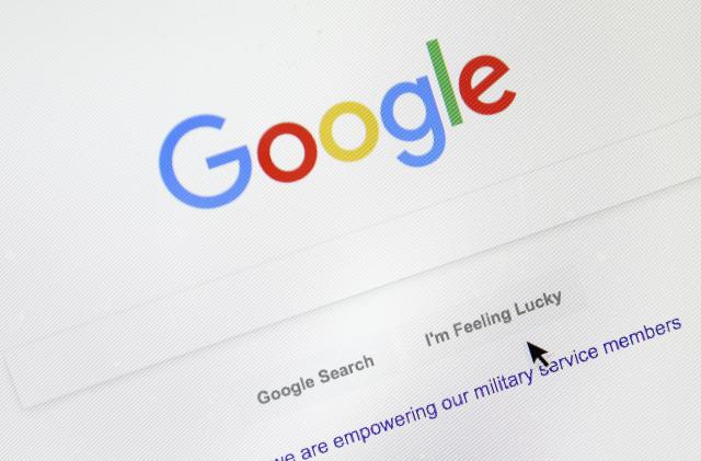 FILE - A cursor moves over Google's search engine page, Aug. 28, 2018, in Portland, Ore. Good news for all the password-haters out there: Google has taken a big step toward making them an afterthought by adding “passkeys” as a more straightforward and secure way to log into its services. (AP Photo/Don Ryan, File)