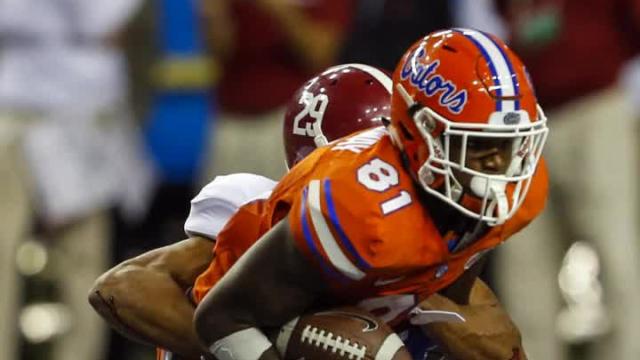 Florida suspends 7 players for Michigan game
