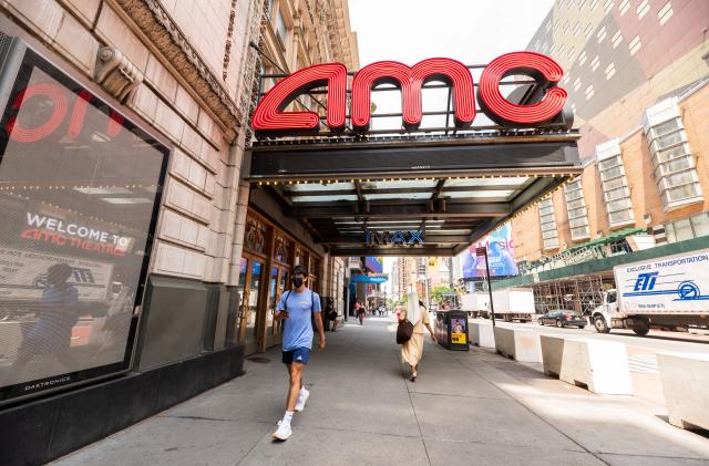 NEW YORK, NEW YORK - JUNE 08: People walk outside AMC Empire 25 movie theater in Times Square on June 08, 2021 in New York City. On May 19, all pandemic restrictions, including mask mandates, social distancing guidelines, venue capacities and curfews were lifted by New York Governor Andrew Cuomo.  (Photo by Noam Galai/Getty Images)