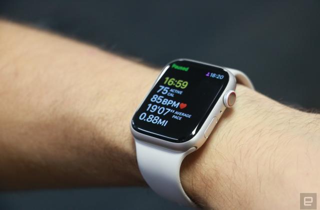 The Apple Watch Series 8 on a person's wrist, showing a paused workout tracking screen.