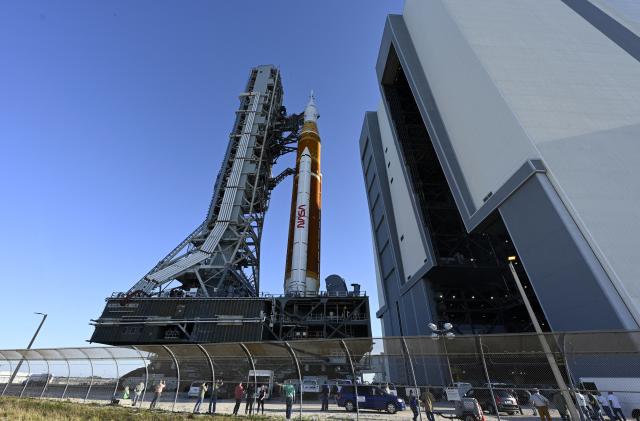 NASA's next-generation moon rocket, the Space Launch System (SLS) rocket with its Orion crew capsule perched on top, makes a highly anticipated, slow-motion journey from the Vehicle Assembly Building (VAB) to its launch pad at Cape Canaveral, Florida, U.S. March 17, 2022. REUTERS/Steve Nesius