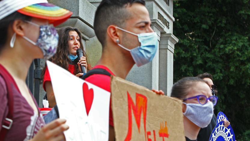 BOSTON, MA - JULY 13: Harvard senior Oya Gursoy, 22, addresses the crowd as Attorney General Maura Healey and international students rally at the State House against ICE visa rules that would potentially remove students from the country or prevent others reentry, weeks before fall semester begins, during the coronavirus pandemic on July 13, 2020 in Boston. (Photo by Pat Greenhouse/The Boston Globe via Getty Images)