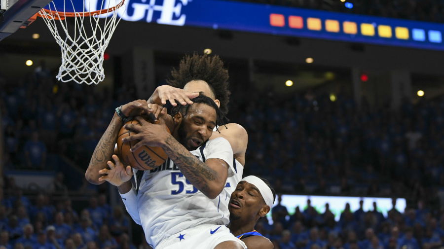 Associated Press - Dallas Mavericks forward Derrick Jones Jr., foreground, and teammate Dereck Lively II, top, challenge Oklahoma City Thunder guard Shai Gilgeous-Alexander, right, for a rebound during the second half in Game 2 of an NBA basketball second-round playoff series, Thursday, May 9, 2024, in Oklahoma City. The Mavericks won 119-110. (AP Photo/Kyle Phillips)