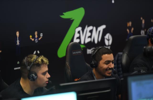 Gamers look on during the "Zevent", the marathon of video games for charity with 54 hours of live gaming with 50 streamers in Montpellier on September 20, 2019. - Headsets harnessed and reserves of energy drinks to last for two days and three nights, 54 French eSport stars have startedthe "Z Event" marathon in Montpellier, to raise funds for the Institut Pasteur. On the other side of their screens, hundreds of thousands of spectators watch them until nightfall from Sunday to Monday on their Twitch channels playing at Fortnite, Minecraft or League of Legends. (Photo by SYLVAIN THOMAS / AFP)        (Photo credit should read SYLVAIN THOMAS/AFP via Getty Images)