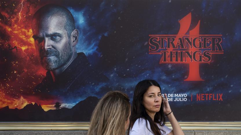 MADRID, SPAIN - 2022/05/27: Pedestrians walk past a street commercial advertisement banner from the American global on-demand Internet streaming media provider Netflix featuring Stranger Things Season 4 TV show in Spain. (Photo by Xavi Lopez/SOPA Images/LightRocket via Getty Images)