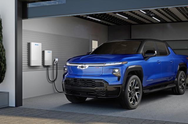 Rendering of a 2024 Chevrolet Silverado EV RST in a residential garage with anticipated Ultium Home offerings. 