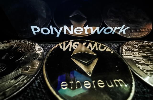 Poly Network logo displayed on a phone screen and representation of Ethereum cryptocurrency is seen in this illustration photo taken in Sulkowice, Poland on August 12, 2021. (Photo by Jakub Porzycki/NurPhoto via Getty Images)