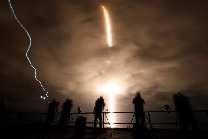 A long exposure shows a SpaceX Falcon 9 rocket, with the Crew Dragon capsule, as it is launched carrying three NASA and one ESA astronauts on a mission to the International Space Station at the Kennedy Space Center in Cape Canaveral, Florida, U.S. November 10, 2021. REUTERS/Thom Baur     TPX IMAGES OF THE DAY