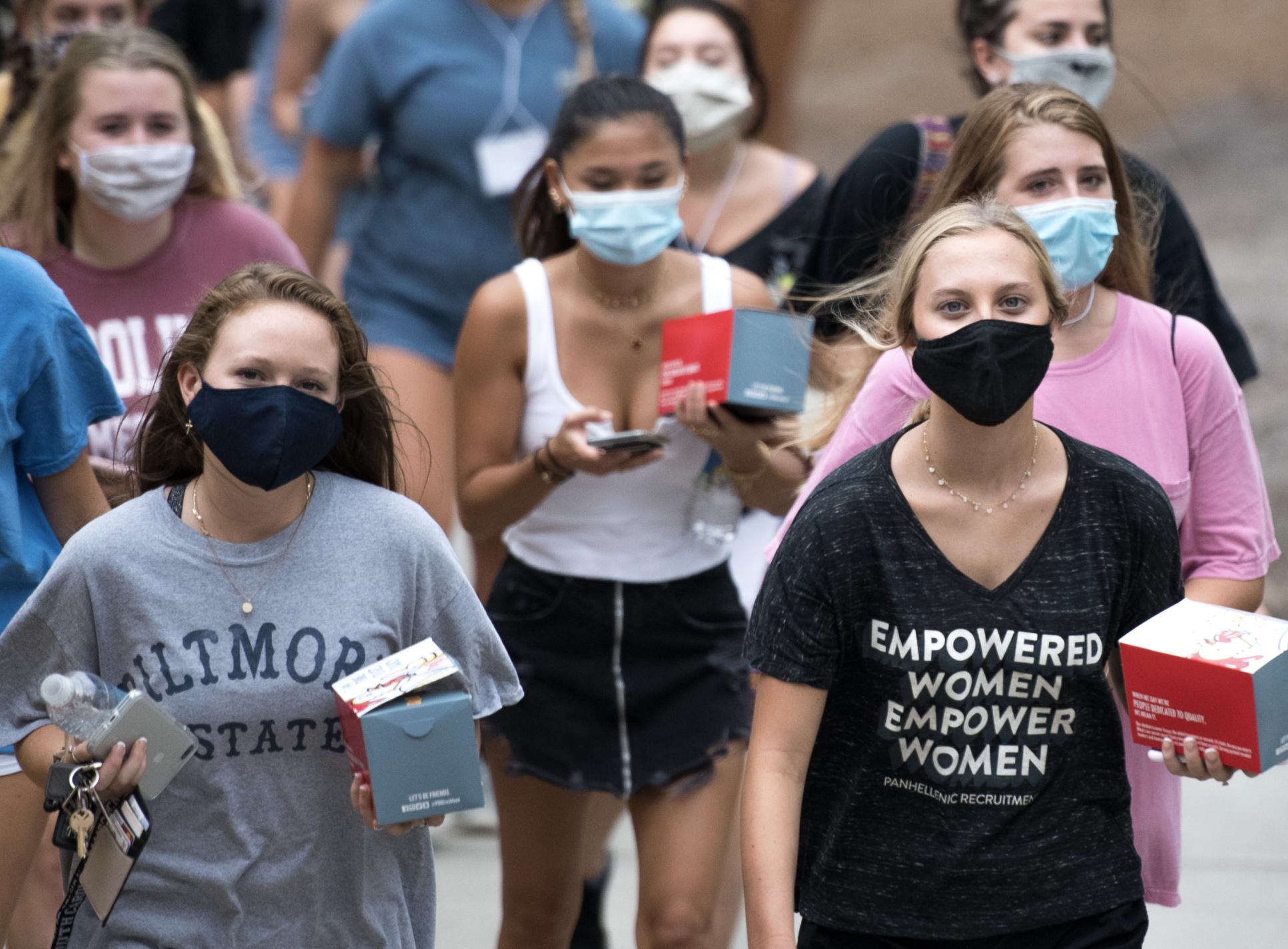 Colleges crack down on campus partying amid derailed pandemic re-openings