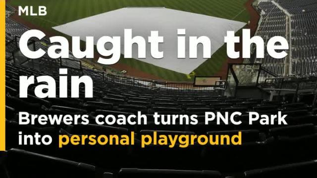 Brewers bench coach turns rain-soaked PNC Park into personal playground