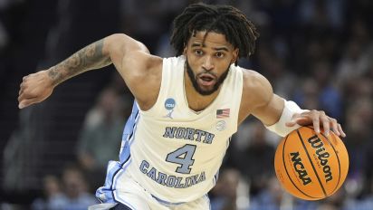 Associated Press - FILE - North Carolina guard RJ Davis (4) brings the ball down court during the first half of a second-round college basketball game against Michigan State in the NCAA Tournament, Saturday, March 23, 2024, in Charlotte, N.C. The first-team Associated Press All-American player is returning to North Carolina to play his fifth season of eligibility, which could have him ultimately contending for the school and Atlantic Coast Conference career scoring record. (AP Photo/Chris Carlson, File)