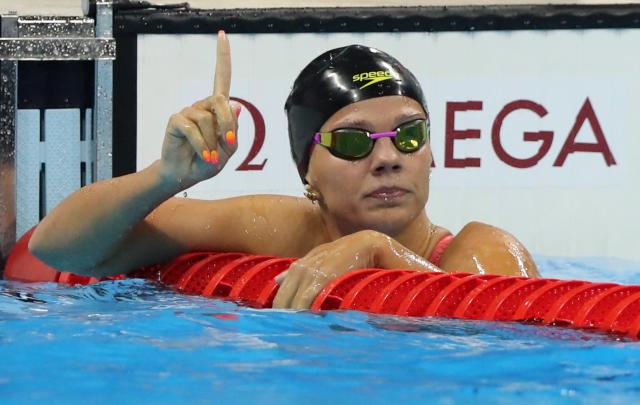 Russia's Yulia Efimova celebrates winning a semifinal of the women's 100-meter breaststroke. (AP)