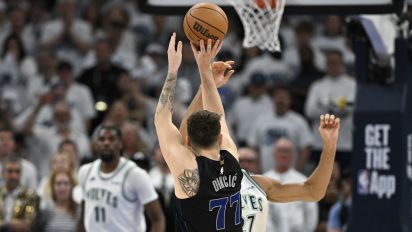 Getty Images - MINNEAPOLIS, MINNESOTA - MAY 24: Luka Doncic #77 of the Dallas Mavericks shoots a three point basket against Rudy Gobert #27 of the Minnesota Timberwolves during the fourth quarter in Game Two of the Western Conference Finals at Target Center on May 24, 2024 in Minneapolis, Minnesota. NOTE TO USER: User expressly acknowledges and agrees that, by downloading and or using this photograph, User is consenting to the terms and conditions of the Getty Images License Agreement. (Photo by Stephen Maturen/Getty Images)