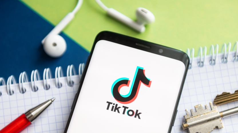 In this photo illustration, a Tik Tok logo seen displayed on...