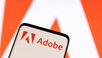 FILE PHOTO: FILE PHOTO: Adobe logo is seen on smartphone in this illustration taken June 13, 2022. REUTERS/Dado Ruvic/Illustration/File Photo/File Photo