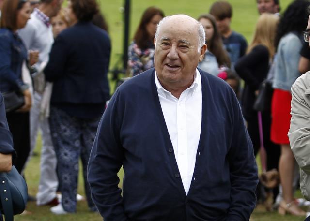 In this July 30, 2016 photo, Amancio Ortega Gaona, founding shareholder of Inditex fashion group, best known for its chain of Zara clothing and accessories retail shops, walks during the Casas Novas International Jumping Show in Arteixo, A Coruña, in the Galicia region of northwest Spain.