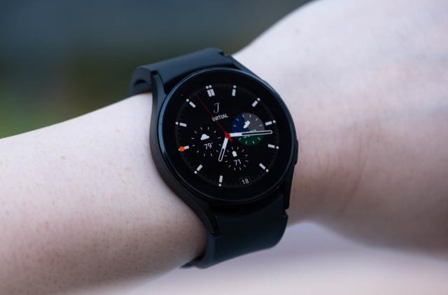 A black Samsung Galaxy Watch 4 on a wrist