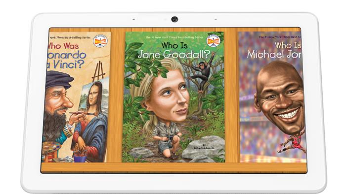 Google Assistant Who Was Stories. A Google Nest smart display showing three storybook covers titled "Who Was Leonardo Da Vinci," "Who Is Jane Goodall" and "Who Is Michael Jordan."