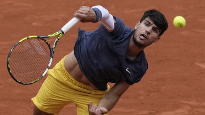 Associated Press - Spain's Carlos Alcaraz serves against Canada's Felix Auger-Aliassime during their fourth round match of the French Open tennis tournament at the Roland Garros stadium in Paris, Sunday, June 2, 2024. (AP Photo/Christophe Ena)