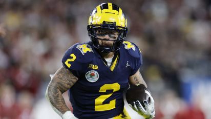 Getty Images - PASADENA, CALIFORNIA - JANUARY 01: Blake Corum #2 of the Michigan Wolverines runs with the ball in overtime against the Alabama Crimson Tide during the CFP Semifinal Rose Bowl Game at Rose Bowl Stadium on January 01, 2024 in Pasadena, California. (Photo by Kevork Djansezian/Getty Images)