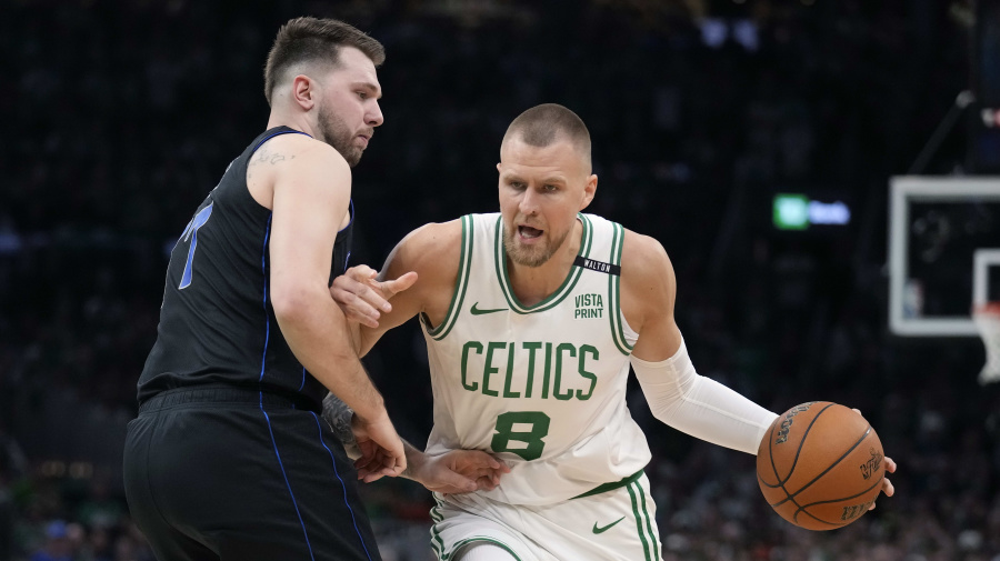 Associated Press - Boston Celtics center Kristaps Porzingis, right, drives as Dallas Mavericks guard Luka Doncic defends during the first half of Game 1 of basketball's NBA Finals on Thursday, June 6, 2024, in Boston. (AP Photo/Charles Krupa)