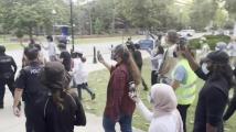 Protesters and police at UF's Plaza of the Americas on Monday