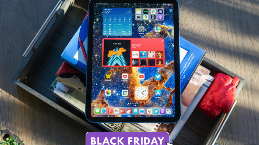 An iPad site on top of a pile of books. Text superimposed on the bottom of the image reads "Black Friday."