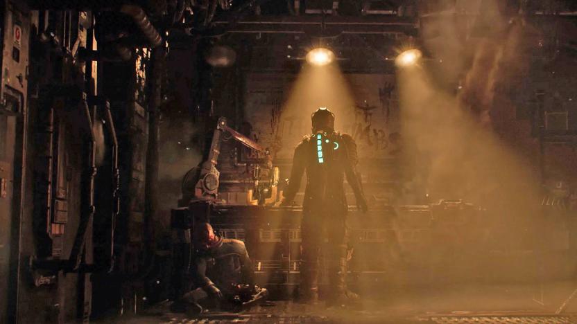 A still from the 'Dead Space' remake from EA and Motive, showing a space-suited character from behind standing at a work bench.
