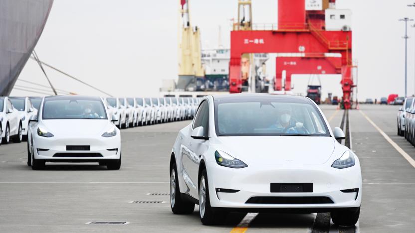 SHANGHAI, CHINA - MAY 15: A total of 4,027 Tesla Model Y and Model 3 electric vehicles, which will be sent to the Port of Zeebrugge in Belgium, wait to be loaded on board the roll-on-roll-off cargo vessel Theben operated by Wallenius Wilhelmsen at Nangang port on May 15, 2022 in Shanghai, China. (Photo by Shen Chunchen/VCG via Getty Images)