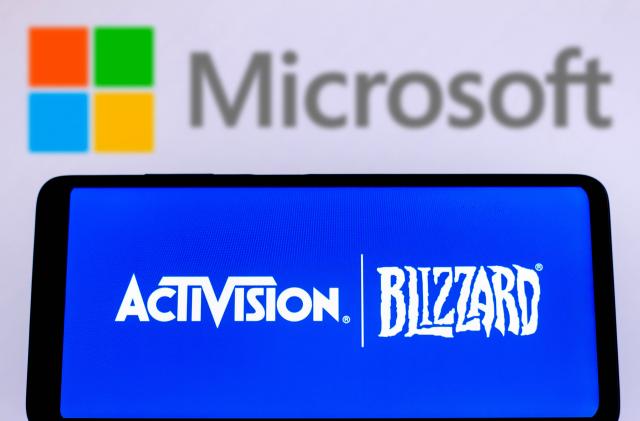 BRAZIL - 2022/02/04: In this photo illustration, Activision Blizzard logo is displayed on a smartphone screen with a Microsoft Corporation logo in the background. (Photo Illustration by Rafael Henrique/SOPA Images/LightRocket via Getty Images)