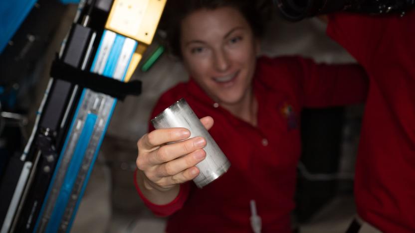 NASA astronaut Kayla Barron replaces a filter in the space station’s Brine Processor Assembly.